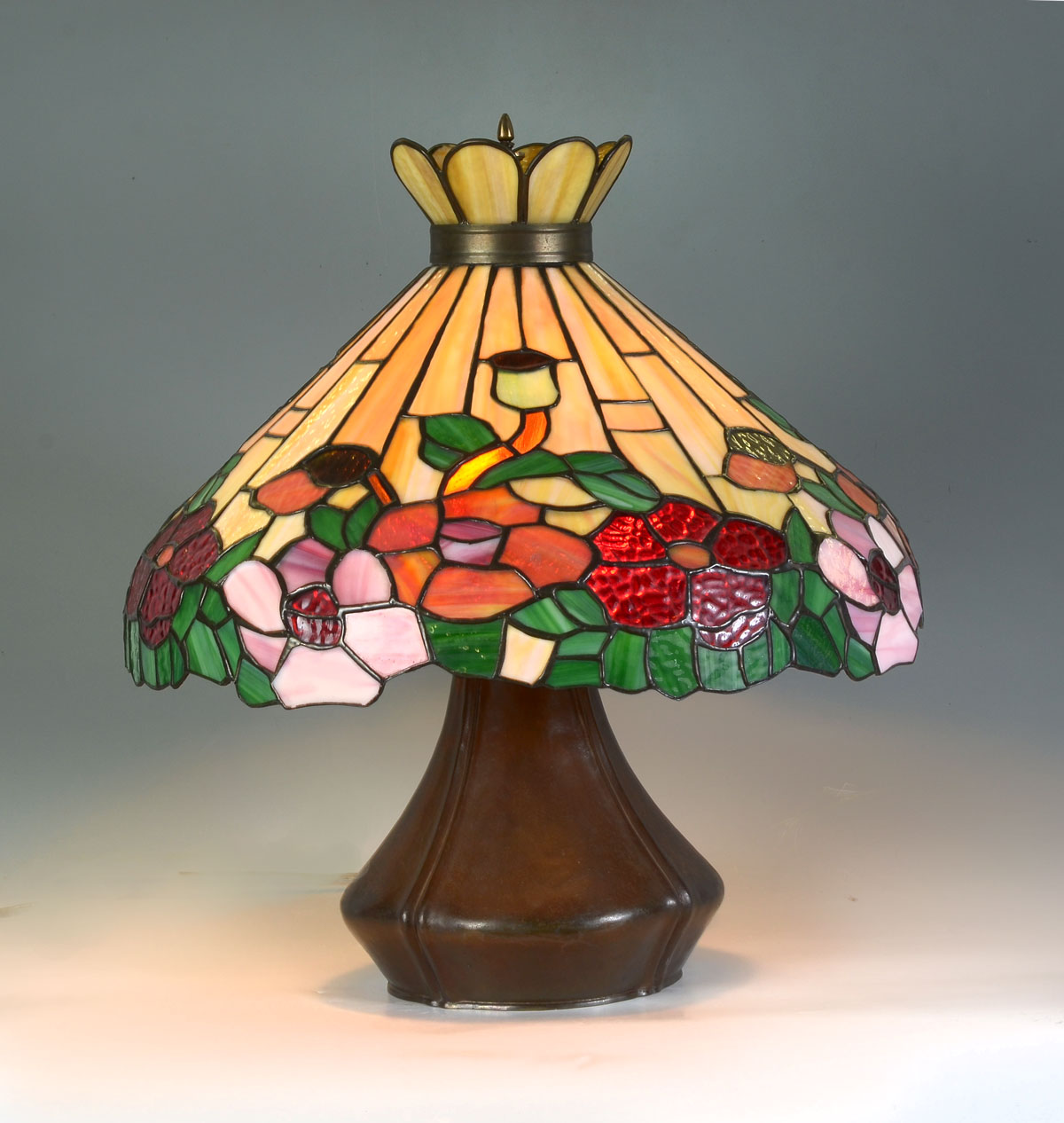 Appraisal: HANDEL STYLE BRONZE LEADED GLASS LAMP Bronze base having a