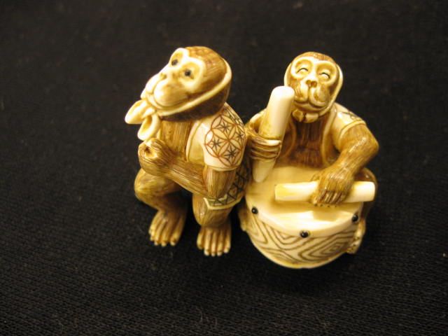 Appraisal: Carved Ivory Figurine of Two Monkeyentertainers on on a drum