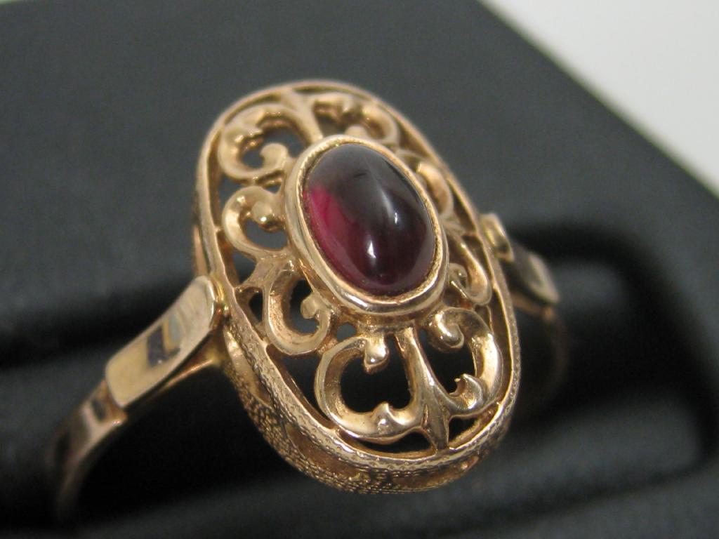 Appraisal: A Russian Ruby Ring the oval cabochon stone collet-set within