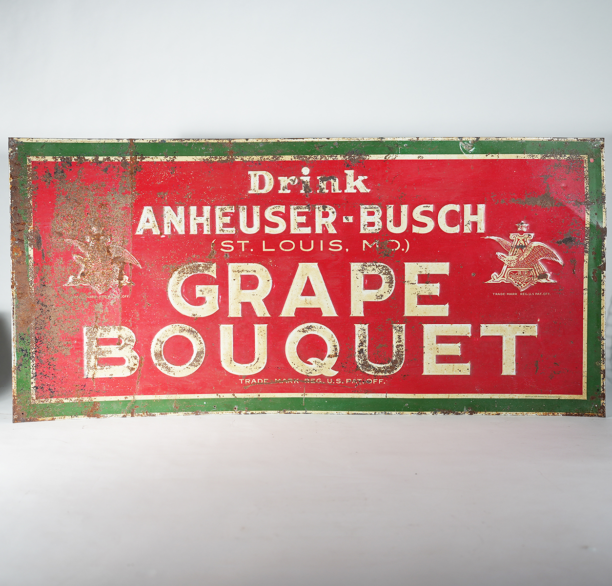 Appraisal: Anheuser-Busch Grape Boquet Embossed Tin SignReference n aBrewery Anheuser-Busch Brewing