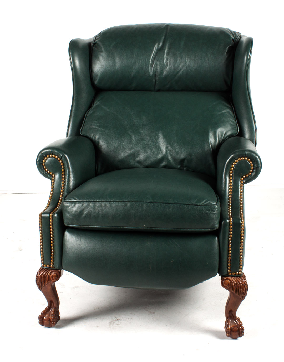 Appraisal: Hancock Moore leather upholstered recliner dark green leather brass tack