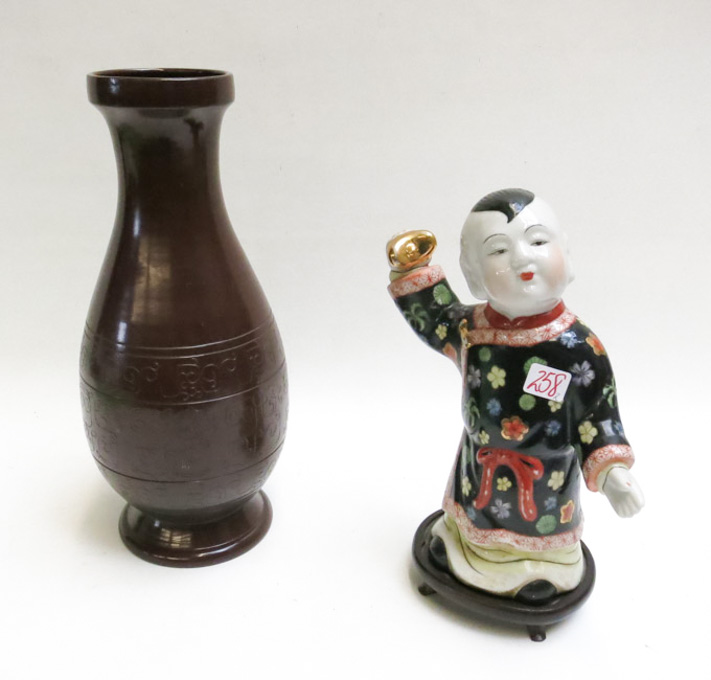 Appraisal: CHINESE PORCELAIN FIGURAL SCULPTURE AND A POTTERY VASE The hand