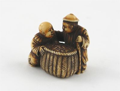 Appraisal: A Japanese ivory netsuke of two figures and a large