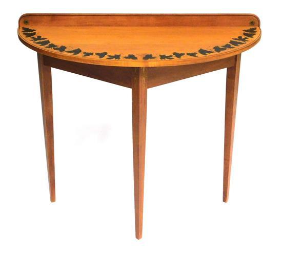 Appraisal: Hitchcock demilune table th C table honey colored finish with