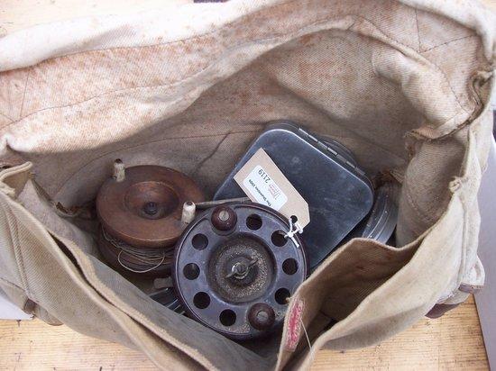 Appraisal: A fishing bag containing a bakelite 'Pixie' fishing reel another