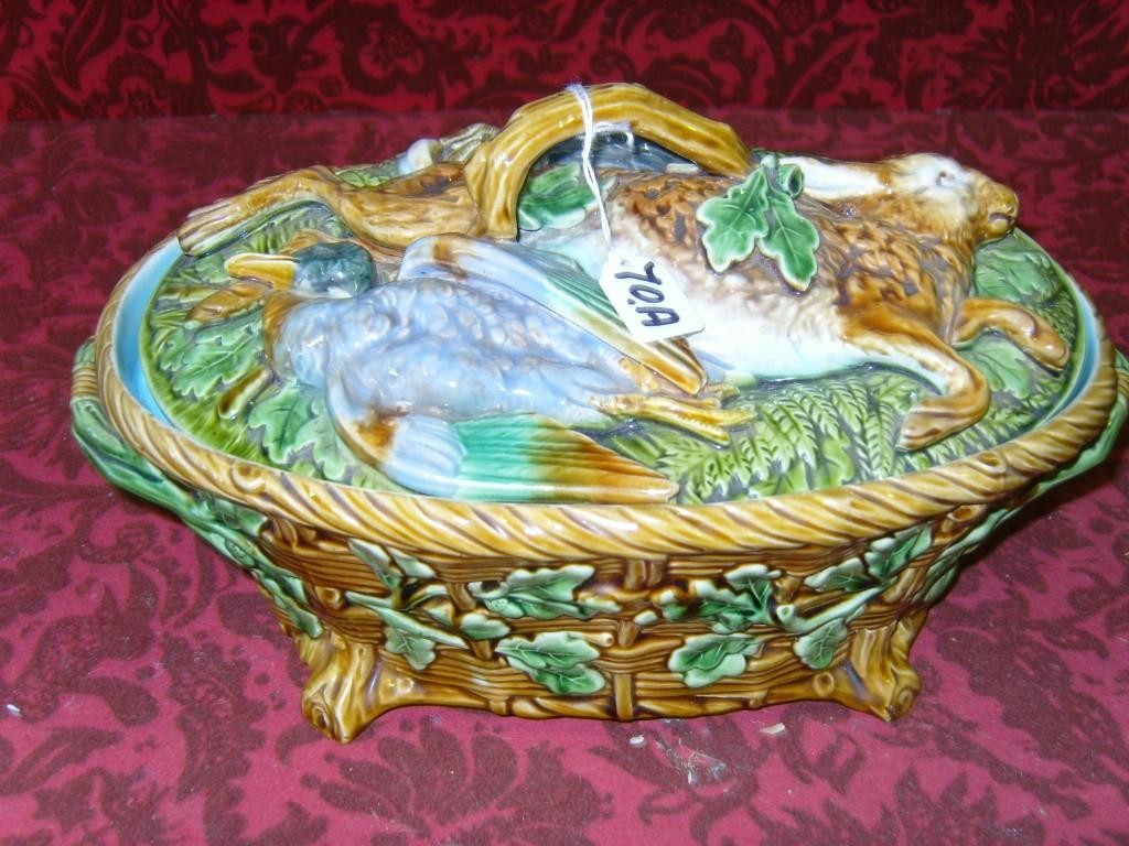 Appraisal: A Mintons majolica game dish and cover the body with