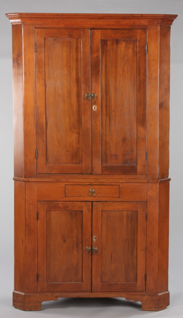 Appraisal: Soft wood case two panel doors over a single drawer