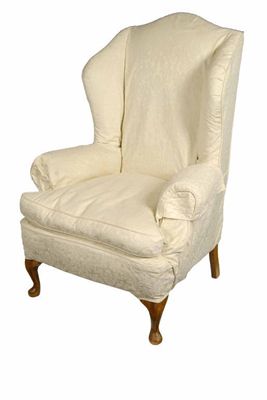 Appraisal: A wing armchair in Queen Anne style with loose covers