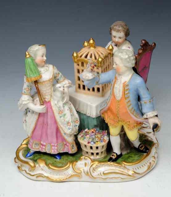 Appraisal: A VIENNA FIGURE GROUP dated modelled as a boy and