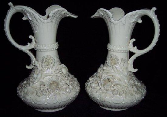 Appraisal: A pair of Belleek Aberdeen jugs of fluted form with