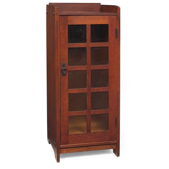 Appraisal: Gustav Stickley music cabinet single door with tenhammered amber glass