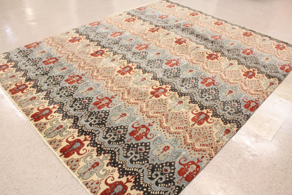 Appraisal: A CONTEMPORARY HAND KNOTTED INDIA CARPET featuring repeating bands of