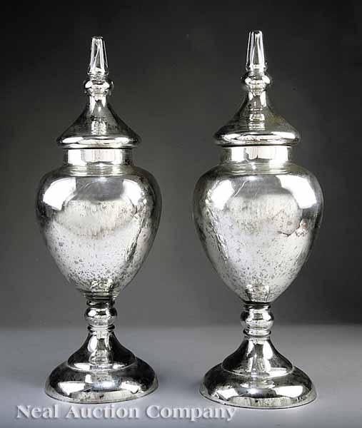 Appraisal: A Pair of Monumental English Mercury Glass Covered Urns mid-