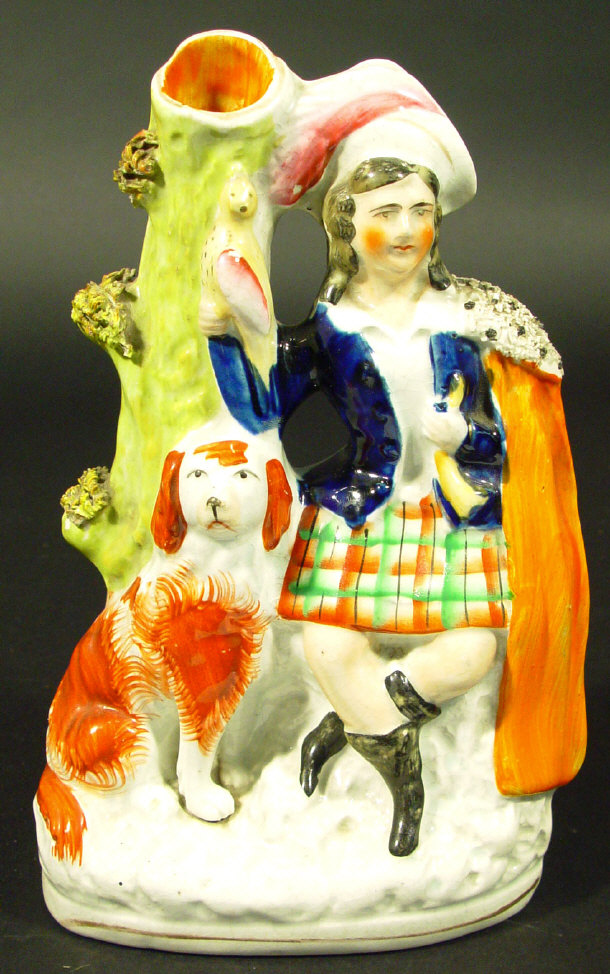 Appraisal: Victorian Staffordshire spill vase modelled with a Scottish Highlander and