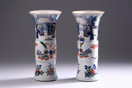 Appraisal: PAIR CHINESE PORCELAIN GU-FORM VASES Polychrome with floral land court