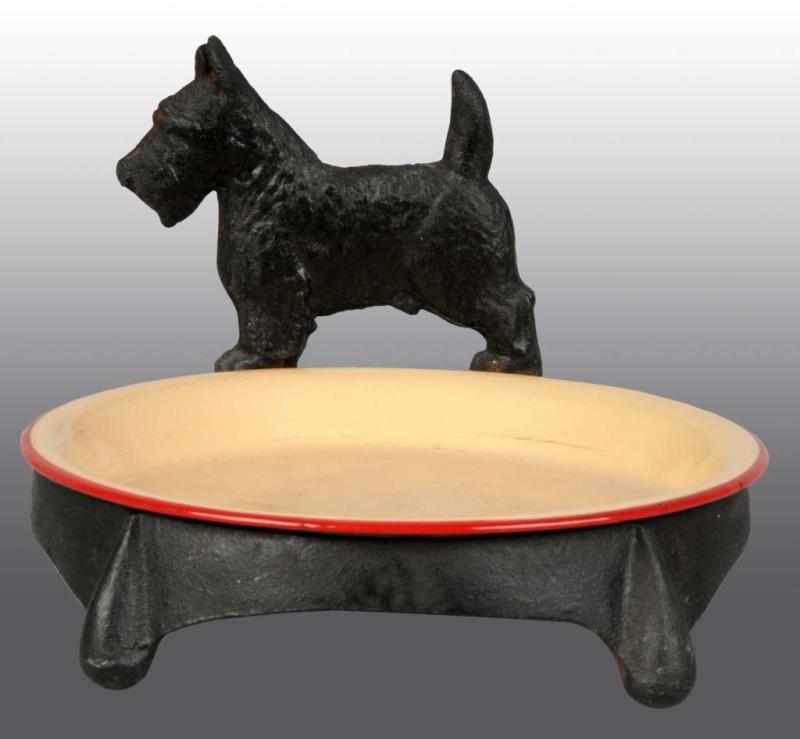 Appraisal: Cast Iron Standing Scottie Pet Feeding Stand Description Has enamel