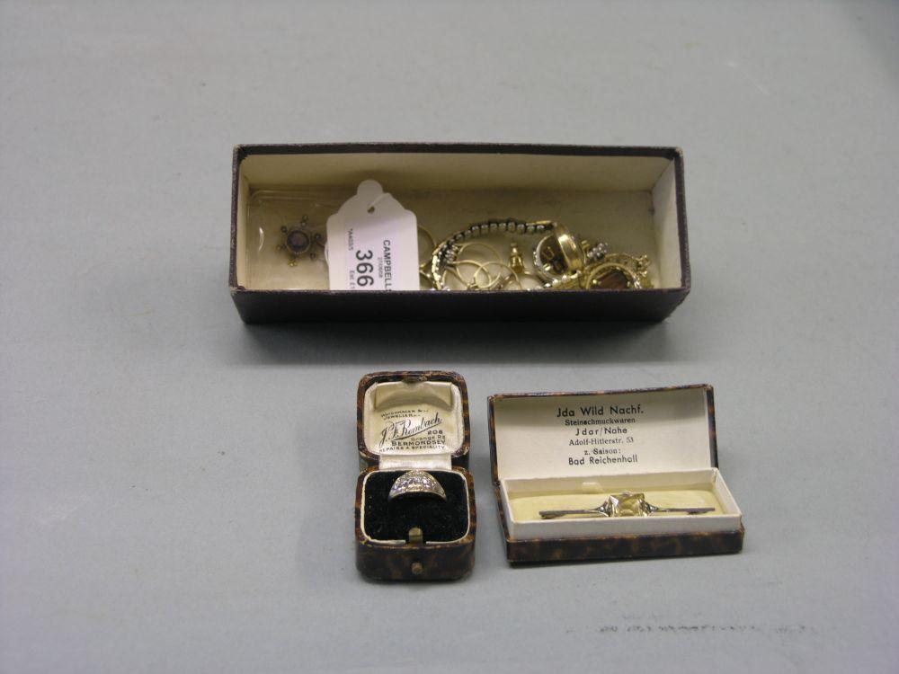 Appraisal: A silver bar brooch set central citrine nine various rings