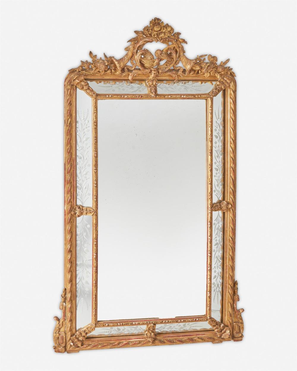 Appraisal: An Italian carved giltwood wall mirror th Century The carved