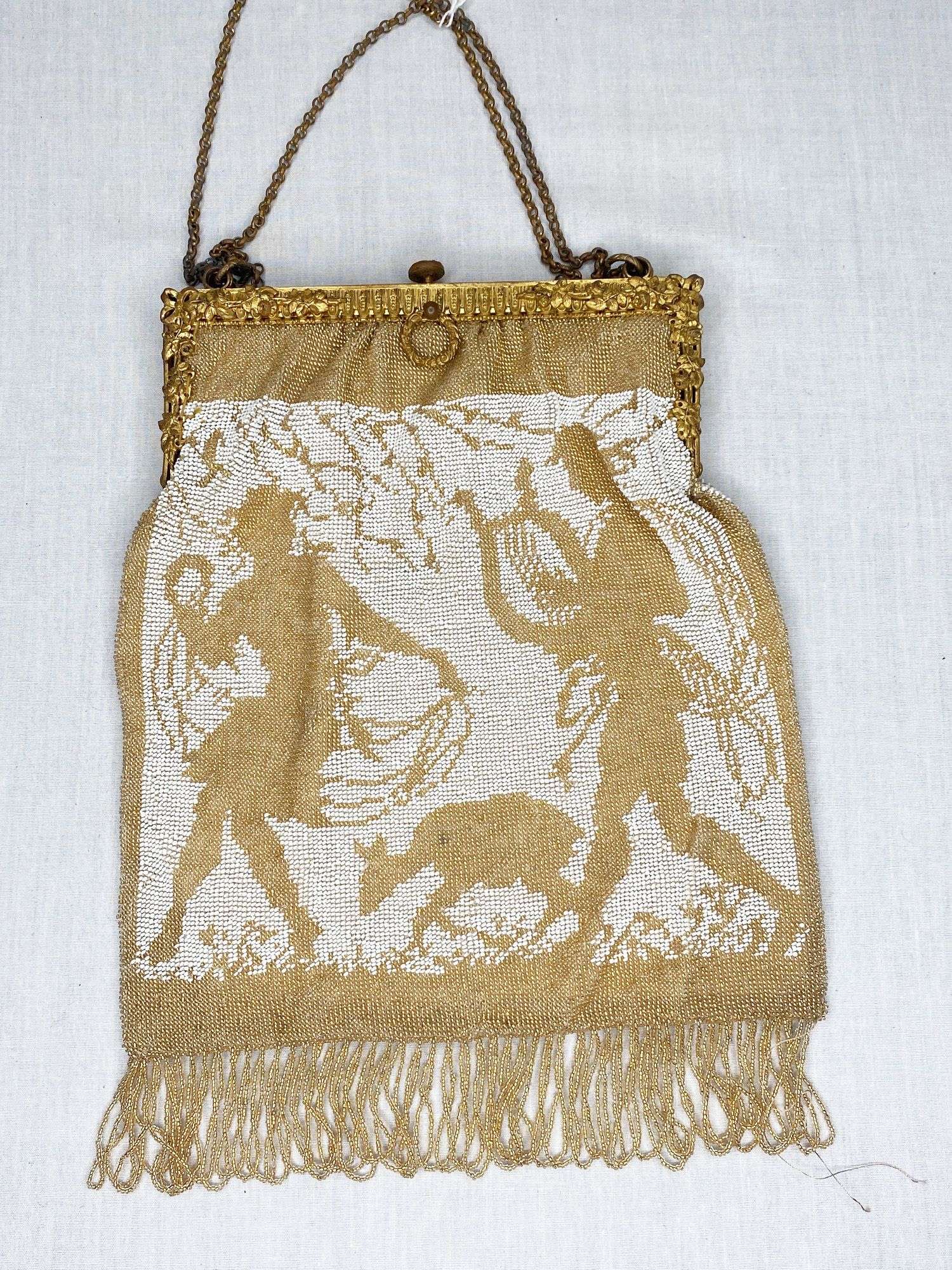 Appraisal: Micro Beaded White and Gold Silhouette Hand Bag long wides