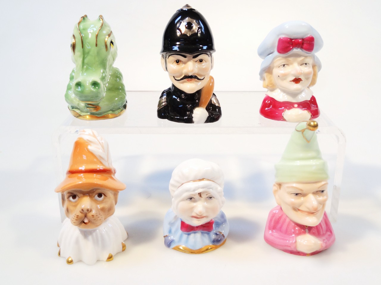 Appraisal: Various Royal Worcester Punch and Judy Collection candle snuffers to