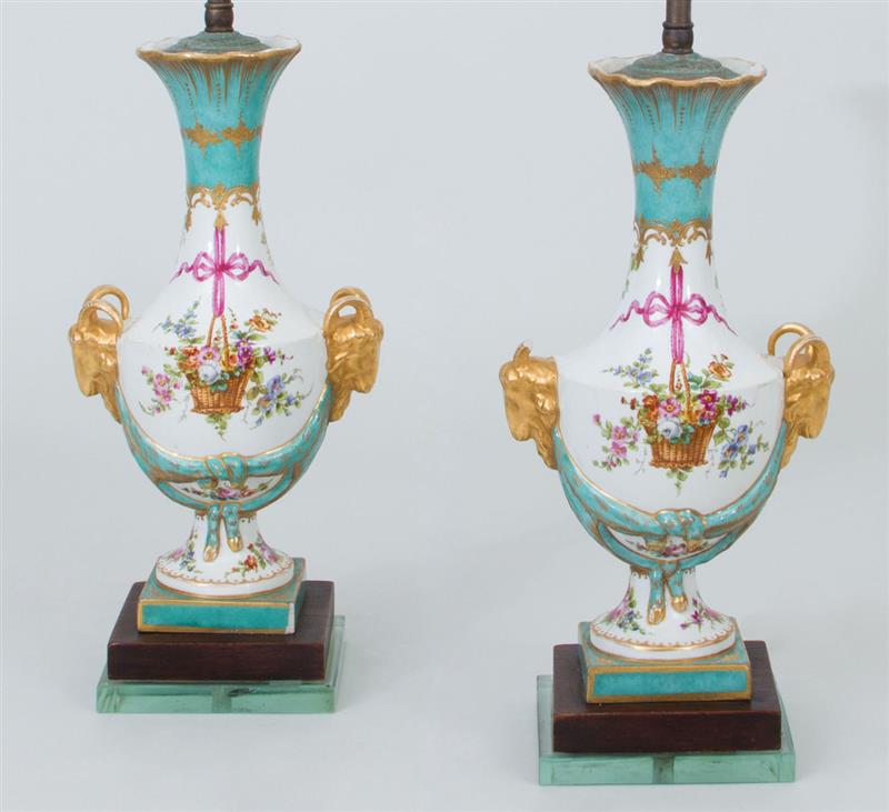 Appraisal: Pair of S vres Style Vases with Ram's Head-Form Handles