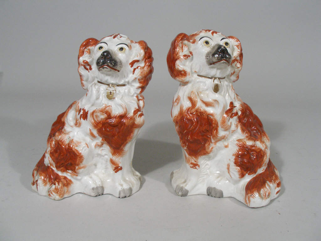 Appraisal: Pair of Staffordshire Dogs c King Charles spaniels once the