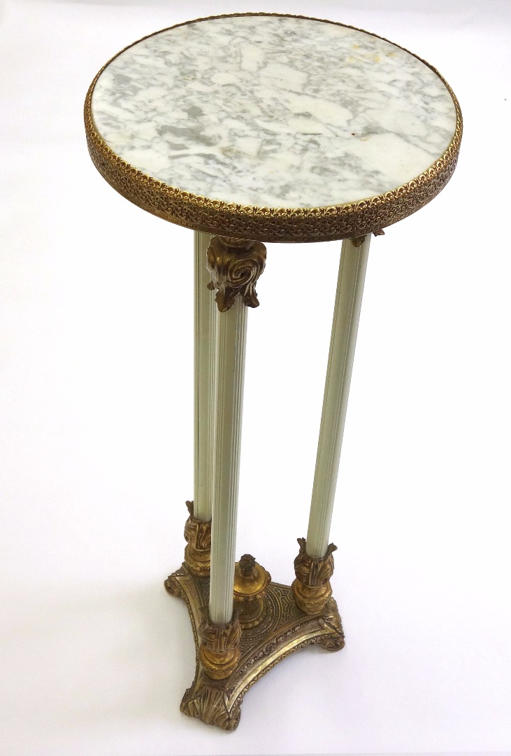 Appraisal: An American gilt metal torchiere in Empire style with circular