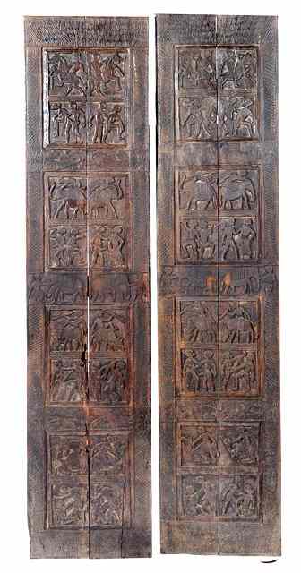 Appraisal: A PAIR OF ANTIQUE NORTHERN INDIAN WOODEN DOORS decorated erotic