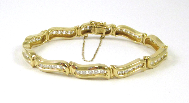 Appraisal: DIAMOND AND FOURTEEN KARAT GOLD BRACELET measuring inches in length