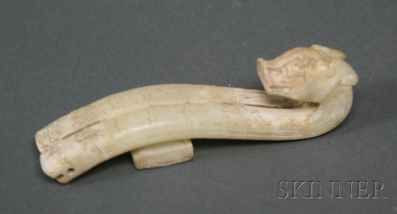 Appraisal: Jade Garment Hook Han-style chicken bone white carved with a