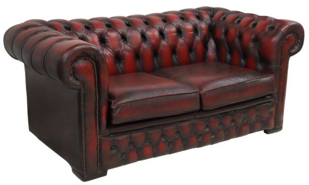 Appraisal: English Chesterfield oxblood leather loveseat sofa th c having oxblood