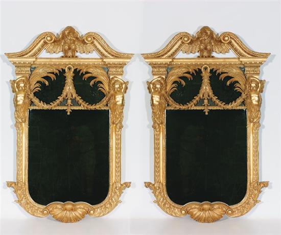 Appraisal: Pair Continental style carved giltwood pier mirrors architectural form surmounted