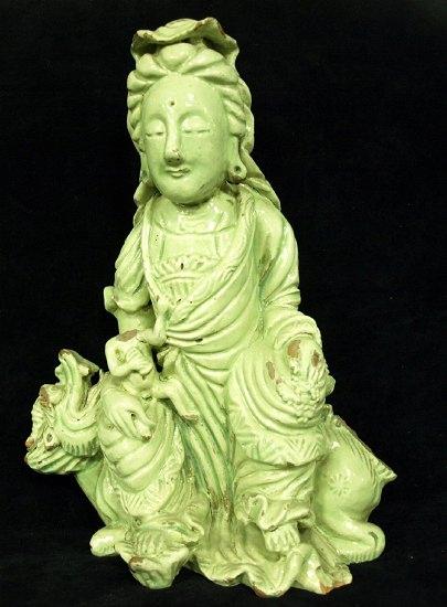 Appraisal: A Chinese ridgetile finial in the form of guanyin seated