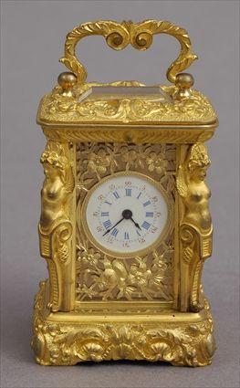 Appraisal: RENAISSANCE-STYLE GILT-METAL SMALL CARRIAGE CLOCK The dial with flowerhead and