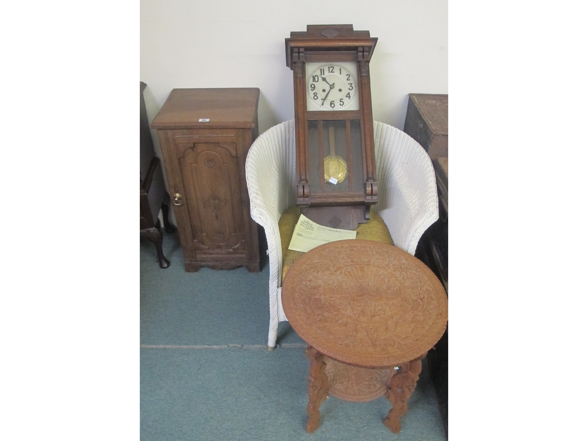 Appraisal: A pot cupboard Lloyd Loom chair wall clock picnic basket