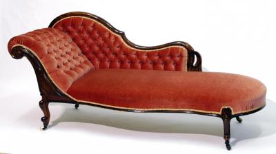 Appraisal: A WALNUT FRAMED BUTTON UPHOLSTERED CHAISE LONGUE of serpentine form