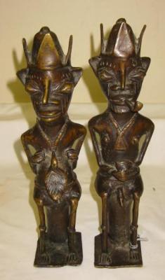 Appraisal: A PAIR OF AFRICAN TRIBAL BRONZE FERTILITY FIGURES modelled as