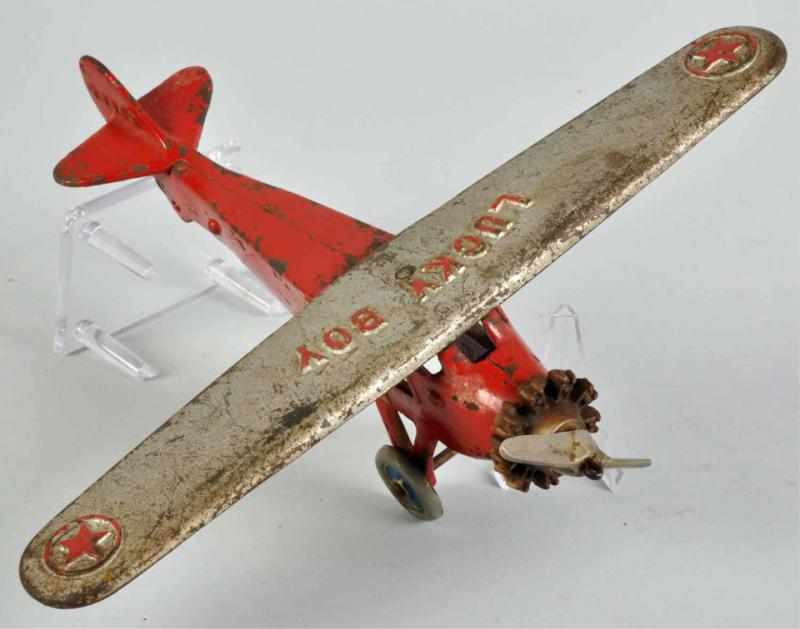 Appraisal: Cast Iron Dent Lucky Boy Airplane Toy Description American Embossed