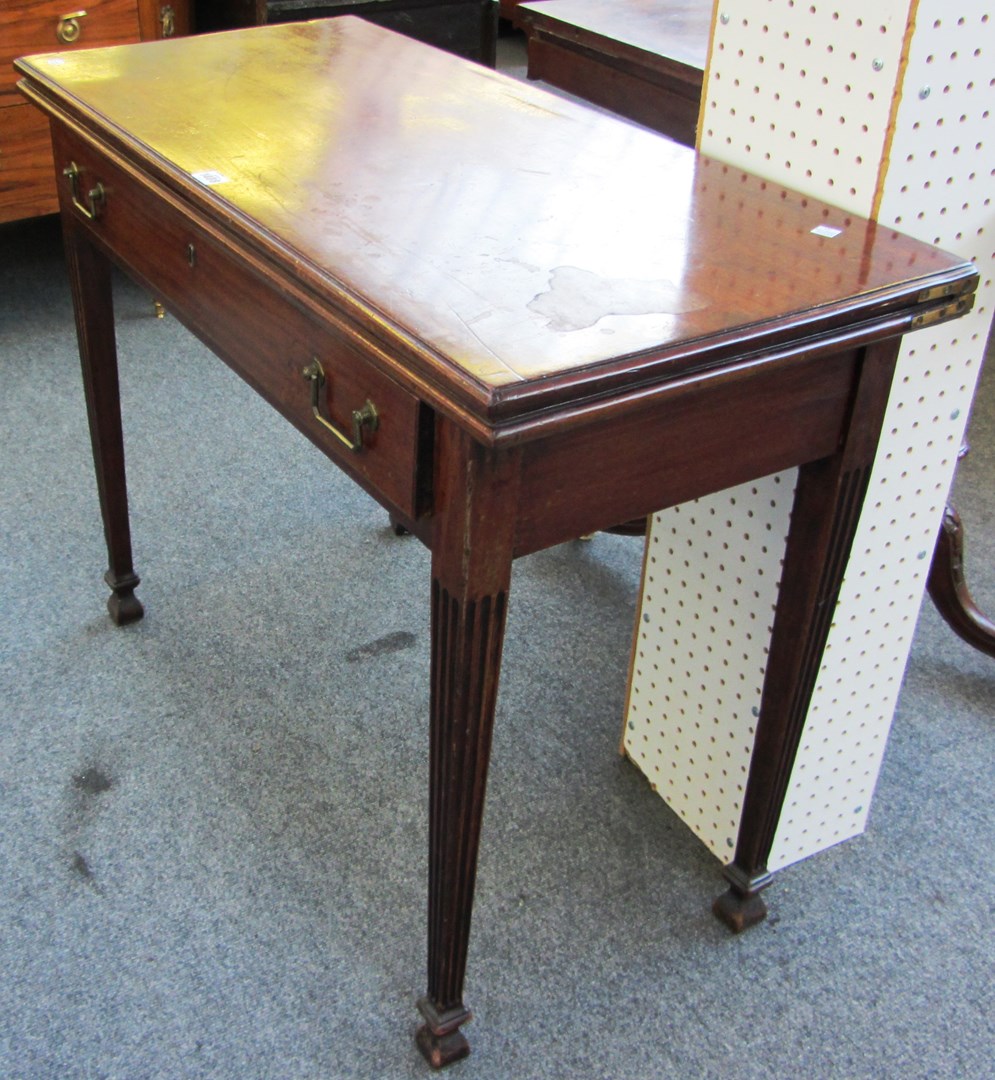 Appraisal: An th century mahogany rectangular tea table on channelled square