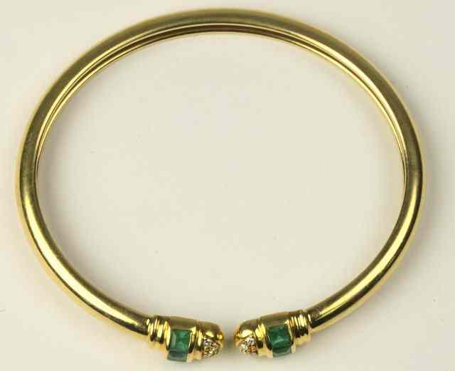 Appraisal: An emerald and diamond set ct yellow gold torque style