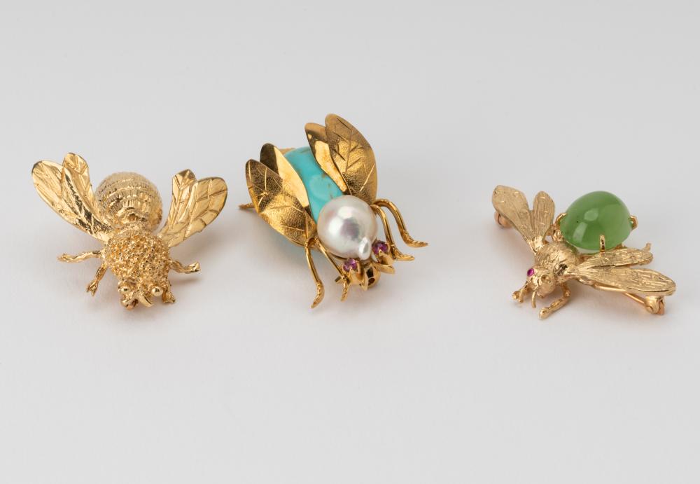 Appraisal: THREE ASSORTED KARAT YELLOW GOLD GEM-SET BUG BROOCHESConsisting of one