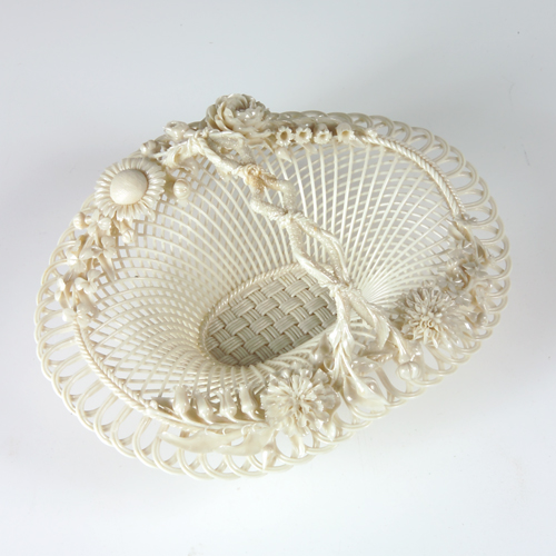 Appraisal: Belleek porcelain openwork basket decorated with delicate floral details on