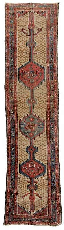 Appraisal: Hamadan Runner Persian ivory field with three stepped medallions and