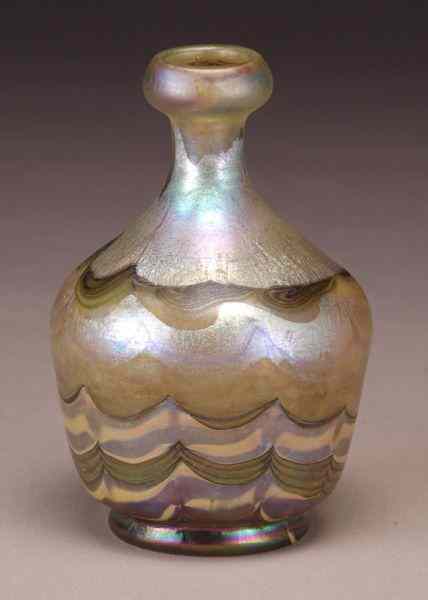 Appraisal: Tiffany Favrile glass decorated cabinet vase of squatty bottle form