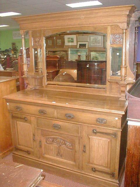 Appraisal: An Edwardian light oak Art Nouveau mirror back sideboard wide