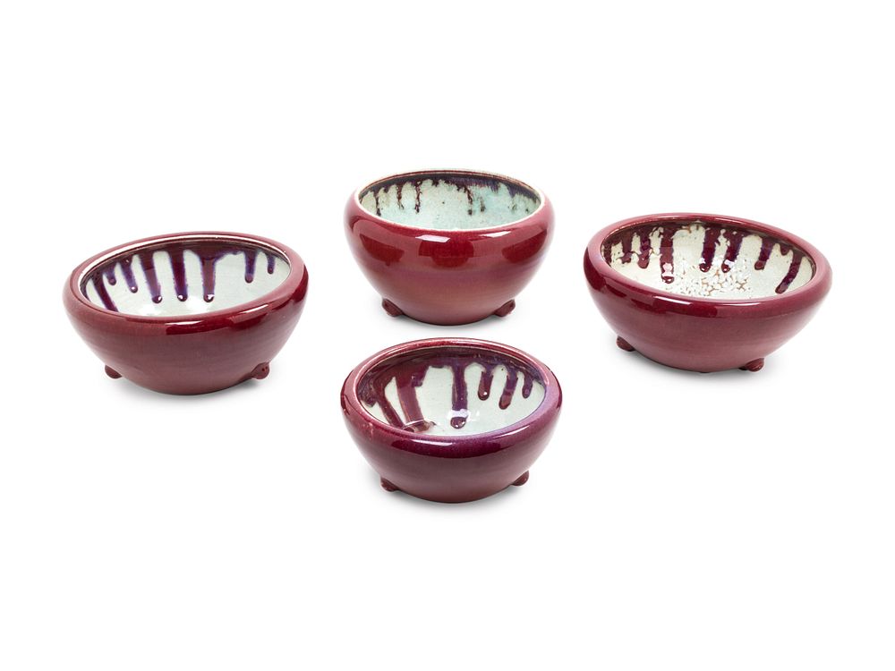 Appraisal: Four Monochrome Red Glazed Tripod Incense Burners Diameter of largest