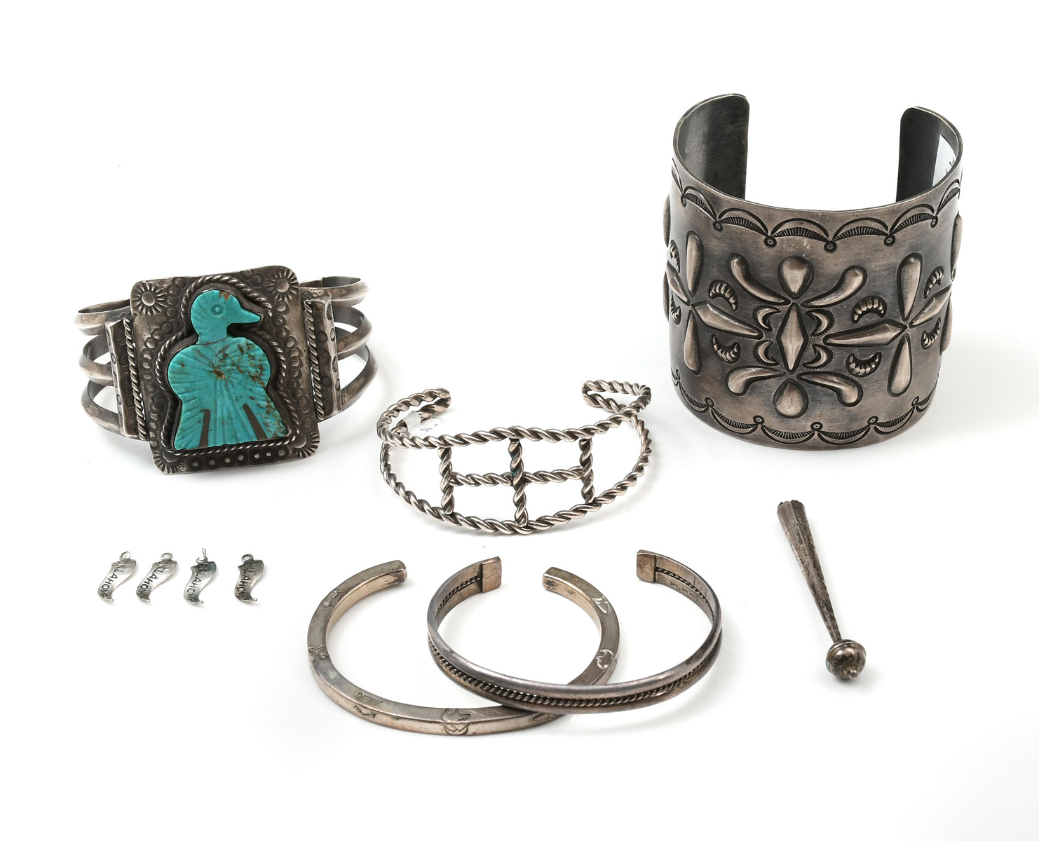 Appraisal: NATIVE AMERICAN STERLING BRACELETS Wide sterling cuff by Navajo artisan