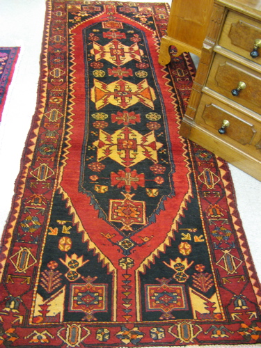 Appraisal: PERSIAN HAMADAN HALL CARPET hand knotted in an overall geometric