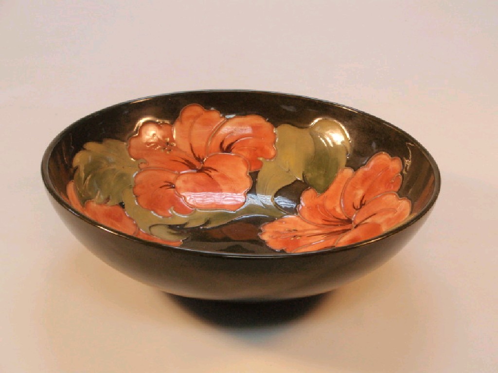 Appraisal: A Moorcroft circular bowl the interior decorated with lilies on