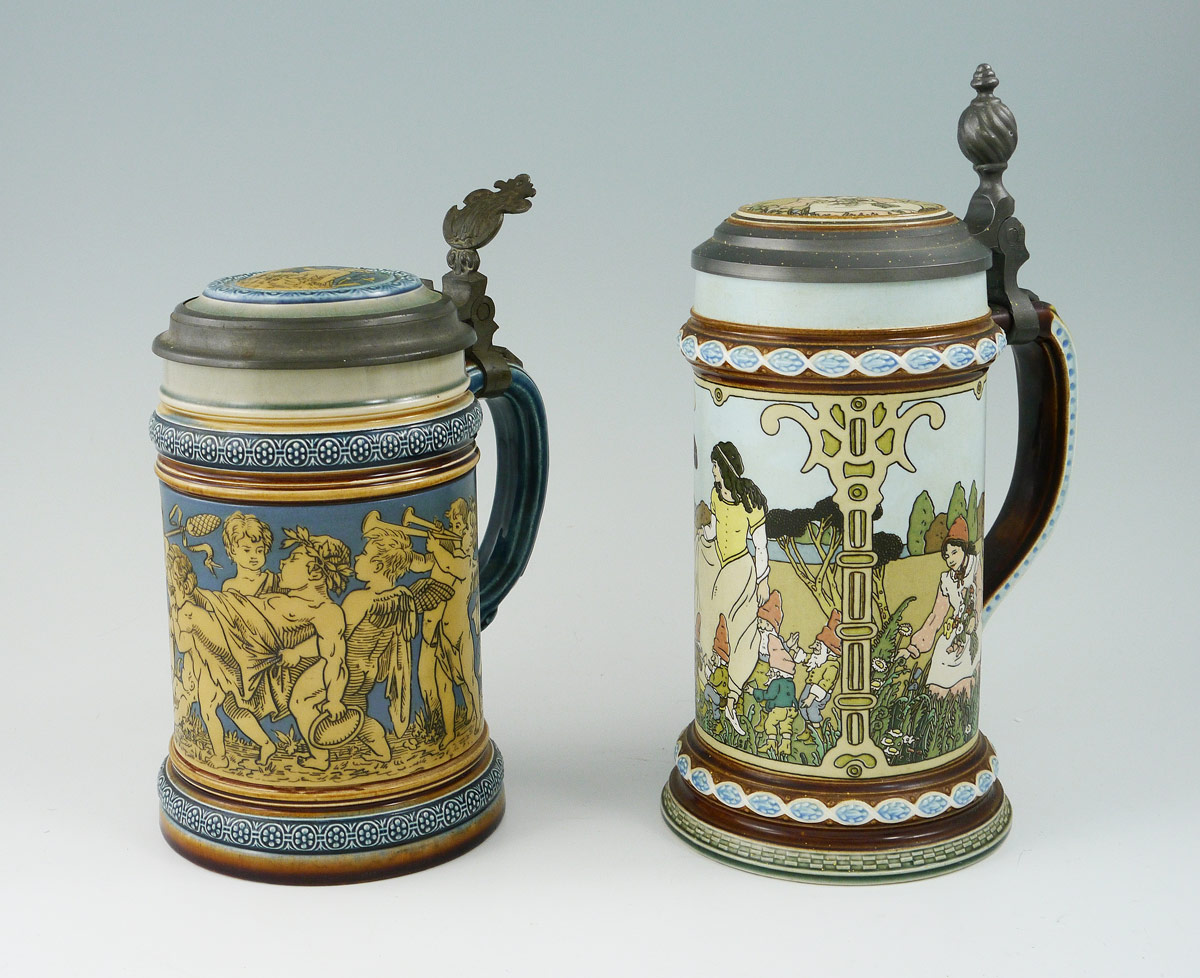 Appraisal: METTLACH STEINS To include incised with cherubs liter hinged lid